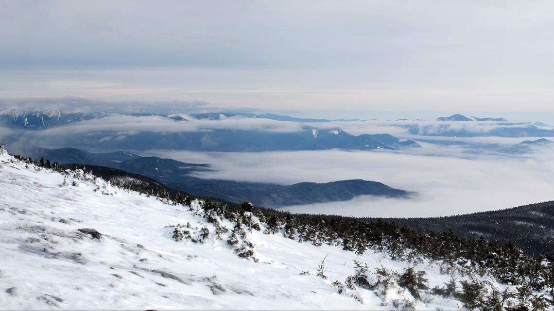 The hikers were caught waist-deep in snow on Mount Moosilauke, New Hampshire rescuers say.