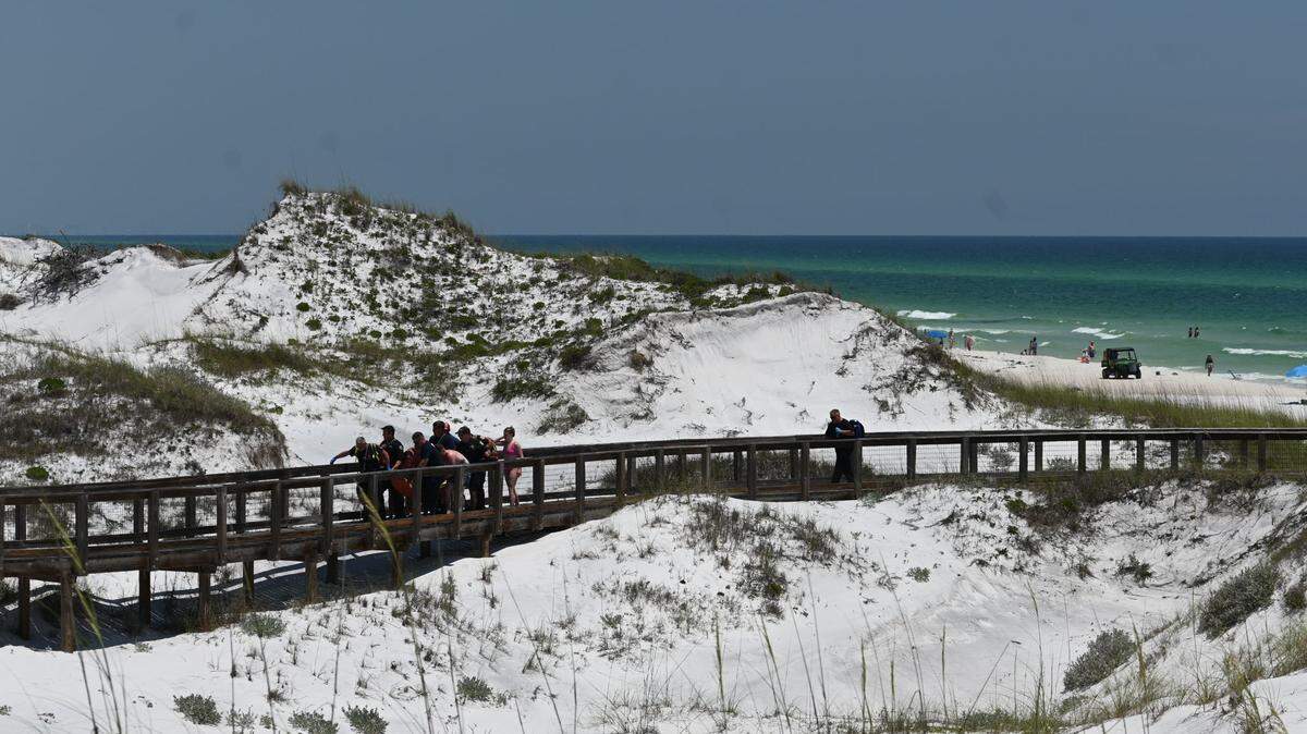 A woman was attacked by a shark in the Florida Panhandle, then two teenagers were attacked less than two hours later, according to Walton County officials.
