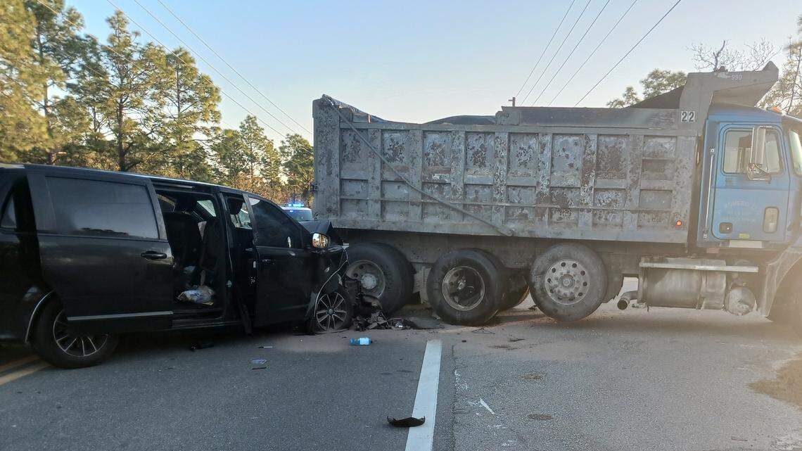A dump truck turned into the path of a minivan, killing a 50-year-old Florida teacher, according to state troopers and a school.