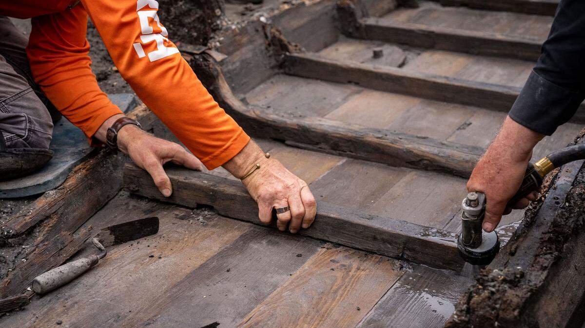 After construction crews uncovered a historical ship in St. Augustine, Florida, archaeologists began excavating it. They used water to de-construct the boat and remove each piece from the construction site.