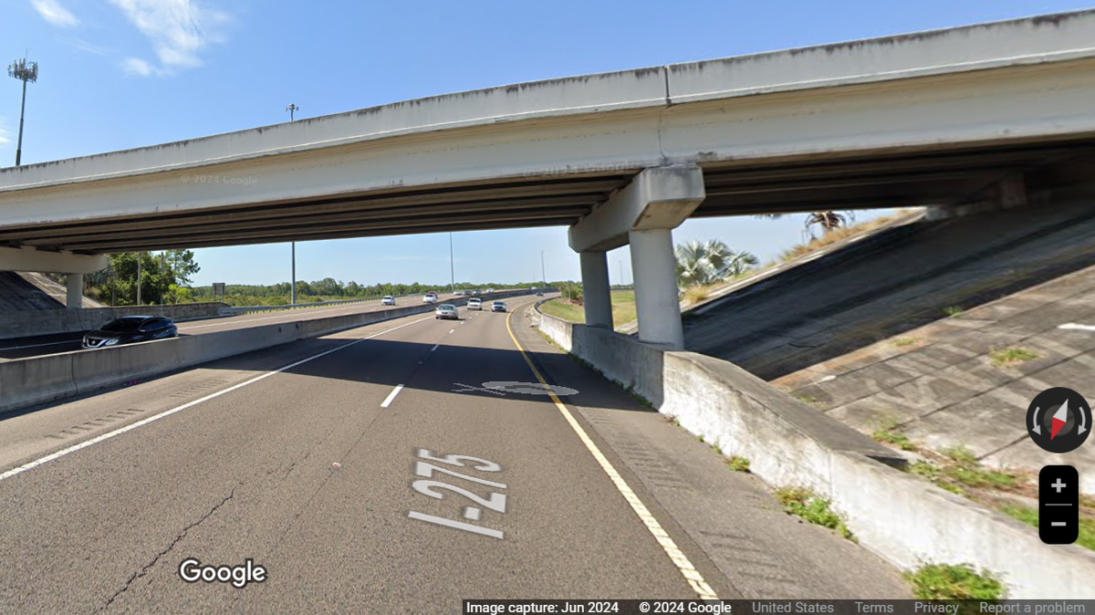 A 31-year-old man fleeing police sustained serious injuries when he leaped from an overpass onto an interstate, Florida law enforcement said.