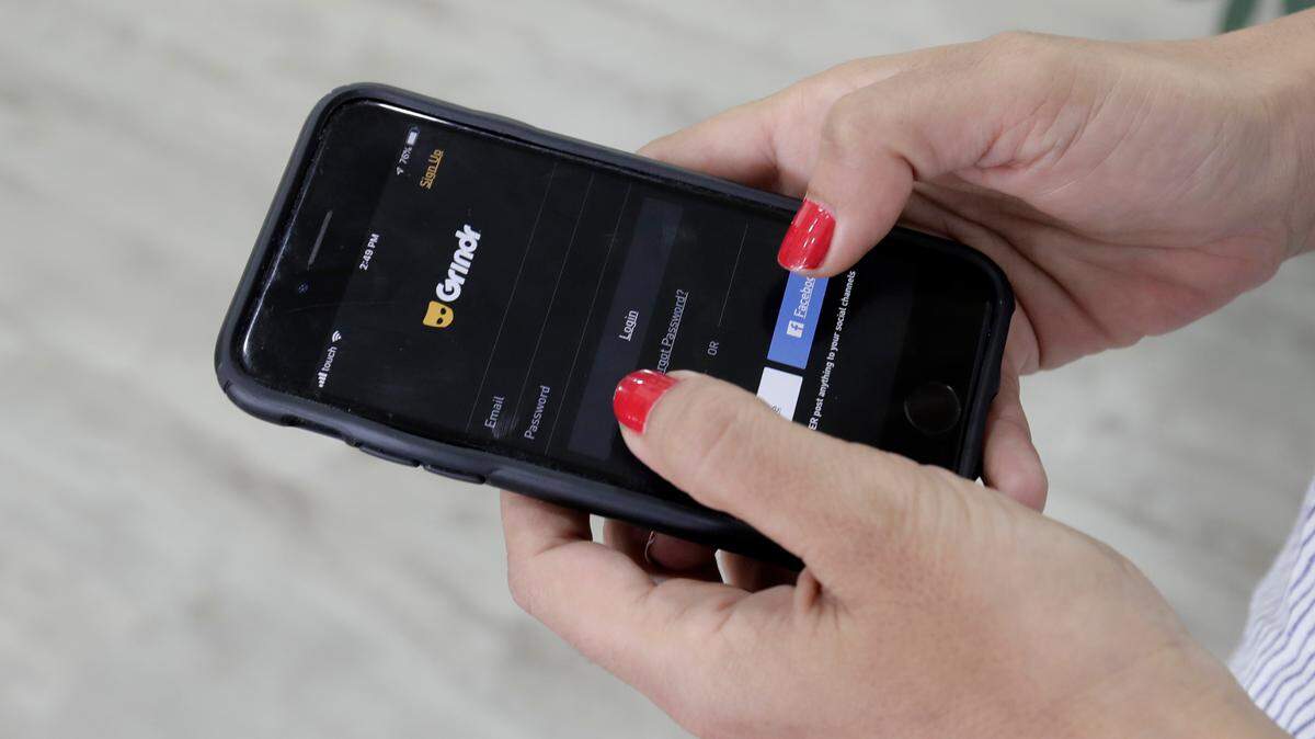 Before TikTok, the U.S. government forced the sale of Grindr, a gay dating app owned by a Chinese company. The two cases have a number of parallels, according to experts. (AP Photo/Hassan Ammar)