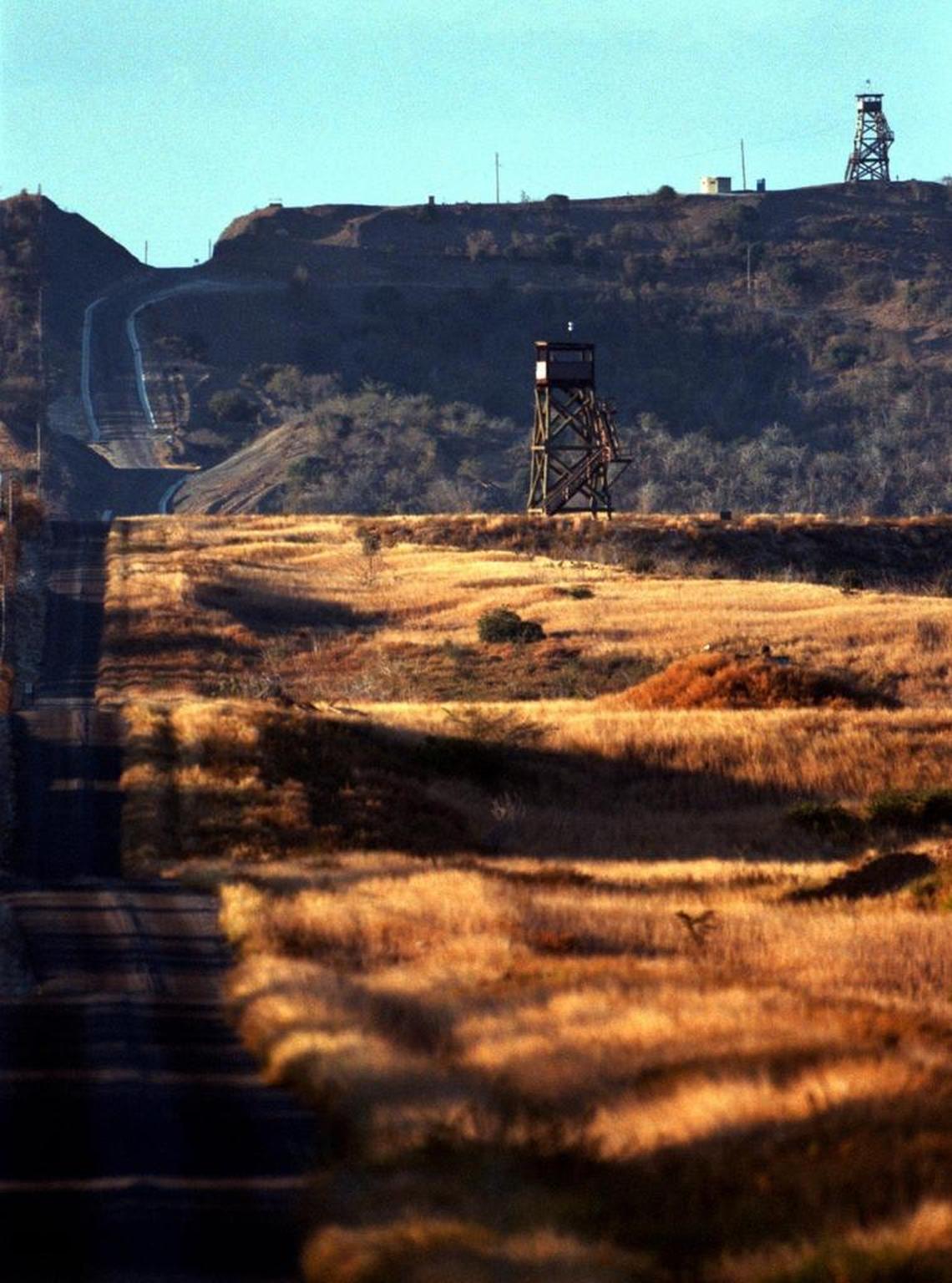 Marine sentry towers line the perimeter of the fence line near the Northeast Gate at Guantánamo on March 18, 1999, a time when each towar was armed with two Marines.