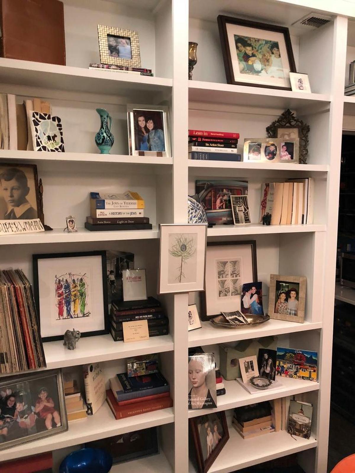 An undated photo shows backward books on a shelf in the Washington, D.C. home of Cari Shane.