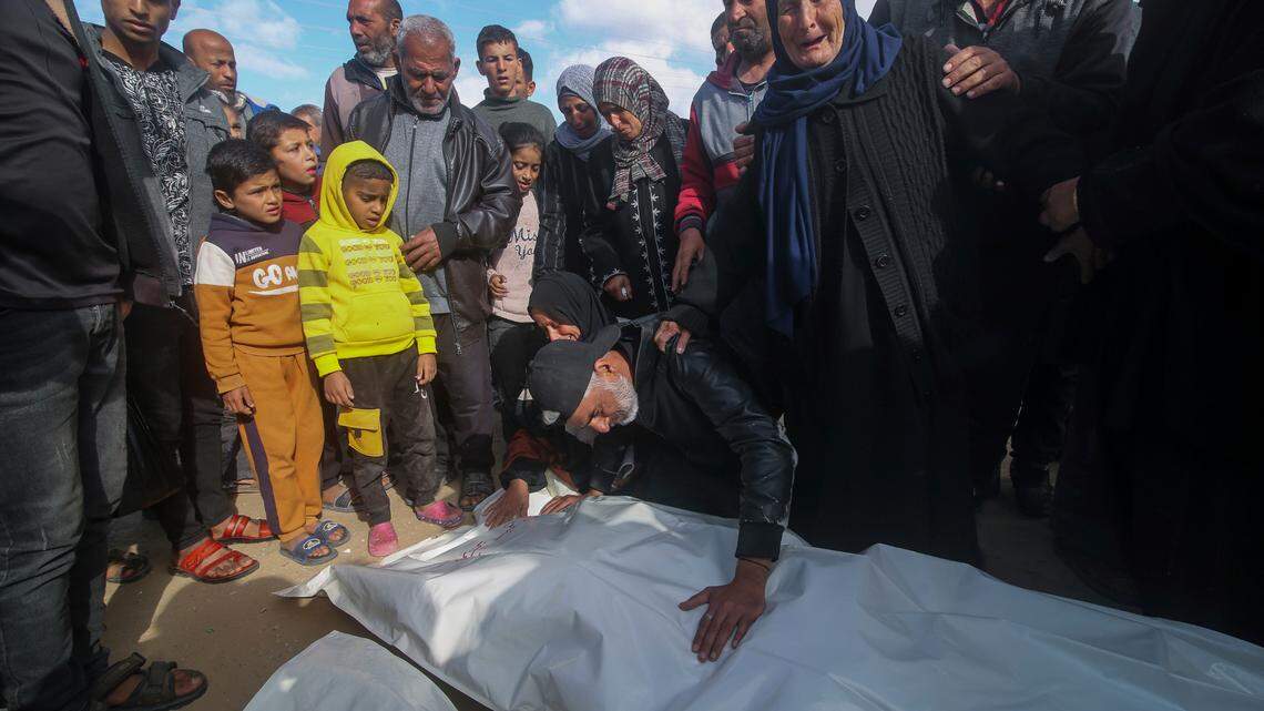 Palestinians mourn over the bodies of their relatives killed in the Israeli bombardment of the Gaza Strip in Khan Younis, on Friday, March 22, 2024.