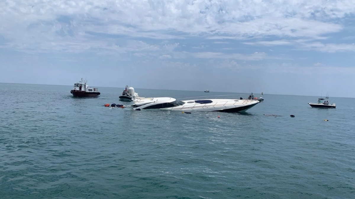 Two people were rescued from a sinking 80-foot yacht near St. Augustine, the Coast Guard said.