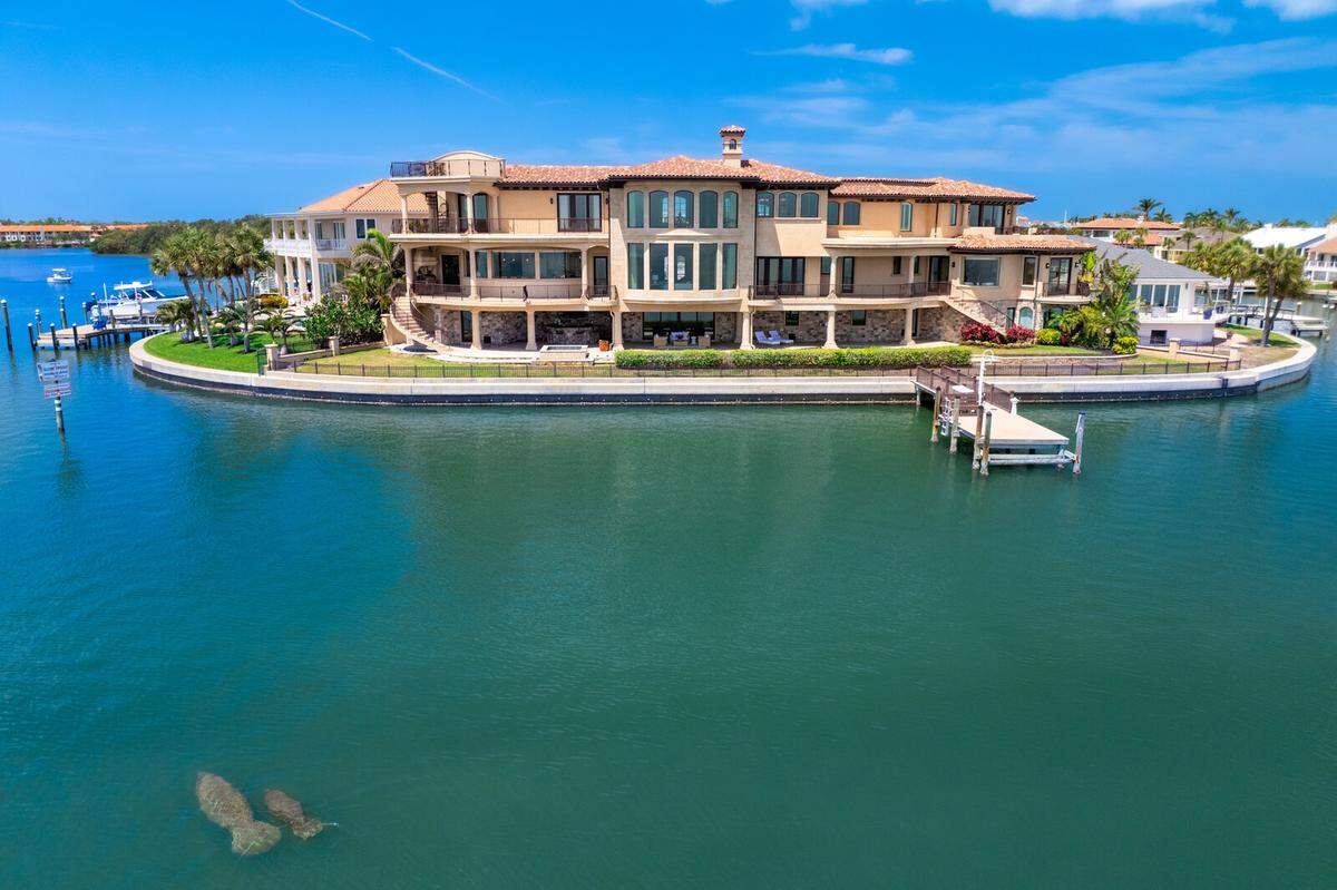 The iconic 7,825-square-foot Mediterranean residence commands nearly 200 feet of prime open water frontage in Tierra Verde’s coveted Sands Point community.