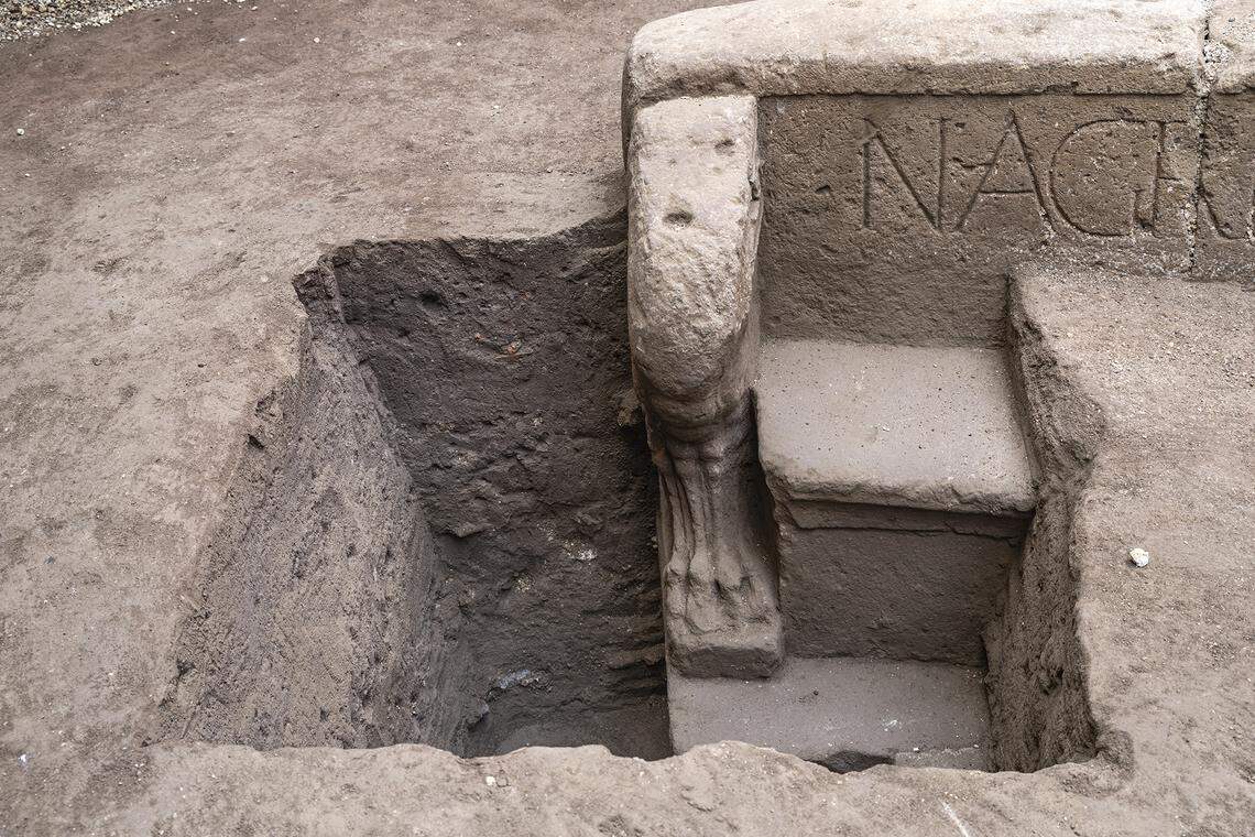 The semicircular grave site was decorated with carvings of lion’s feet, officials said.