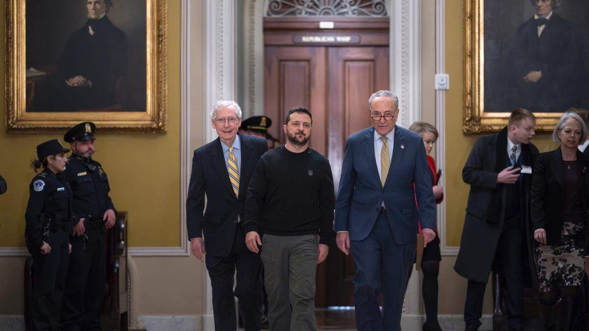 Ukrainian President Volodymyr Zelenskyy, center, is escorted by Senate Minority Leader Mitch McConnell, R-Ky., left, and Senate Majority Leader Chuck Schumer, D-N.Y., and as he comes to the Capitol in Washington to issue a plea for Congress to break its deadlock and approve continued wartime funding for Ukraine, Tuesday, Dec. 12, 2023. (AP Photo/J. Scott Applewhite)