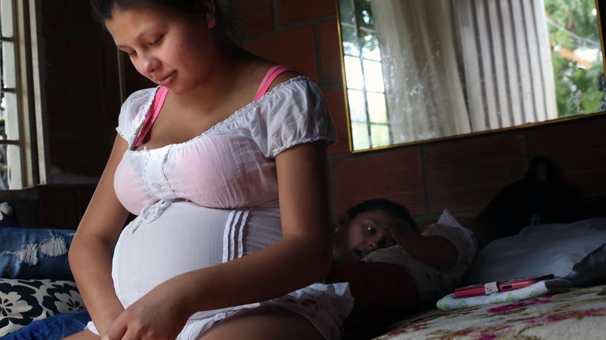 A pregnant woman sits on a bed after being released from the hospital where she was treated for the Zika virus in Cucuta, Colombia, on Sunday, Feb. 7, 2016. Alejandro Gaviria, Colombia's health minister, says the country has nearly 20,500 cases of the mosquito-borne Zika virus.