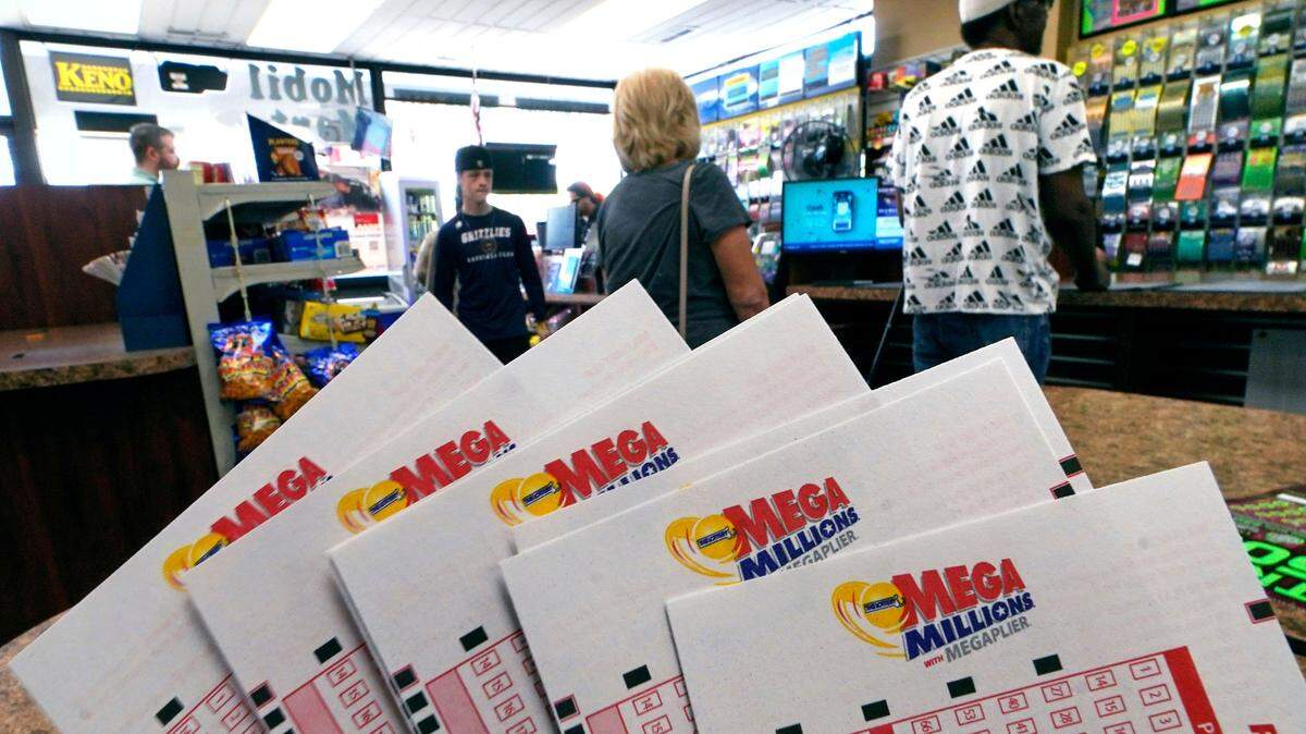 A winning Mega Million ticket was sold in Georgia as the lottery jackpot swells to $792 million. (AP Photo/Charles Krupa)