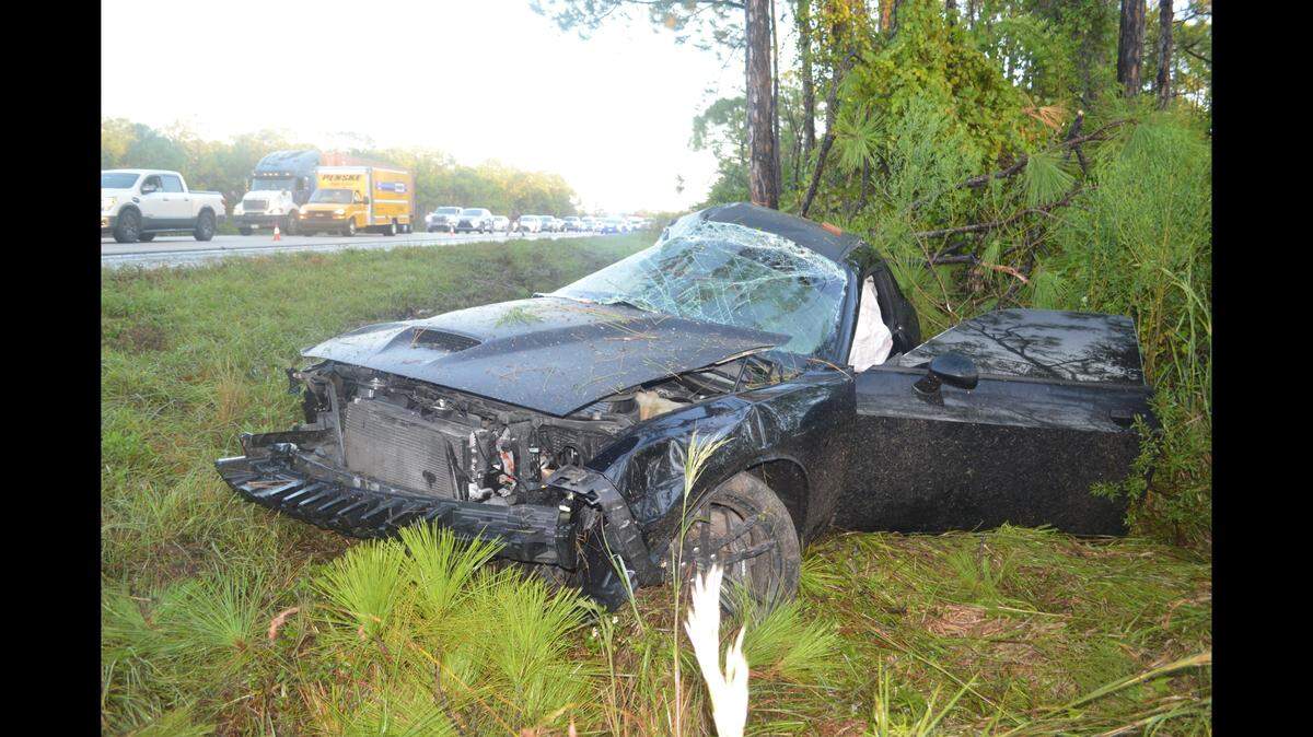 A Challenger cut off by a Mustang during a race on I-75 ended in both cars hitting trees, as the Mustang flipped and the 37-year-old driver of the Challenger died, Florida Highway Patrol said.