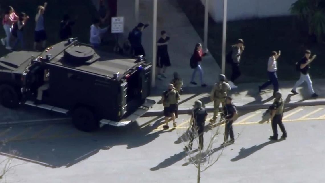 In this frame grab from video provided by WPLG-TV, students from Marjory Stoneman Douglas High School in Parkland, Fla., evacuated the school following a shooting Wednesday.