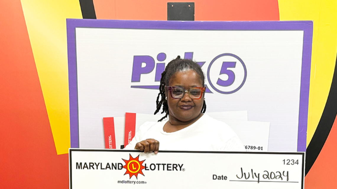 The woman won big on a Pick 5 ticket, which she bought during a coffee stop, using her birthday numbers, Maryland Lottery officials said.