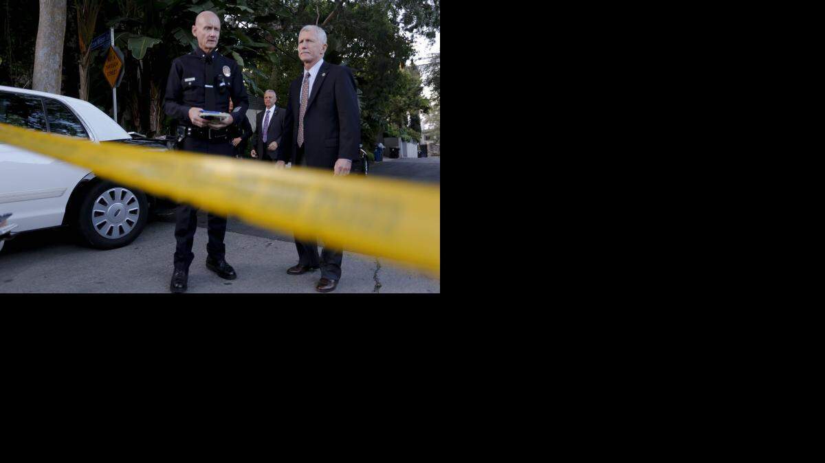 
LAPD Commander Andrew Smith, left, and Commander William Hayes of LAPD Homicide, right, prepare to talk with the media after a body, believed to be that of 47-year-old Andrew Getty, the grandson of oil tycoon J. Paul Getty, was found in his Hollywood Hills, Calif., home, on Tuesday, March 31, 2015. 
