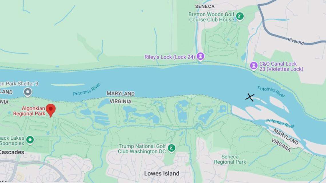 A pair of boaters clung to a tree in the middle of the raging Potomac River after their small boat was swept downstream, rescuers said.