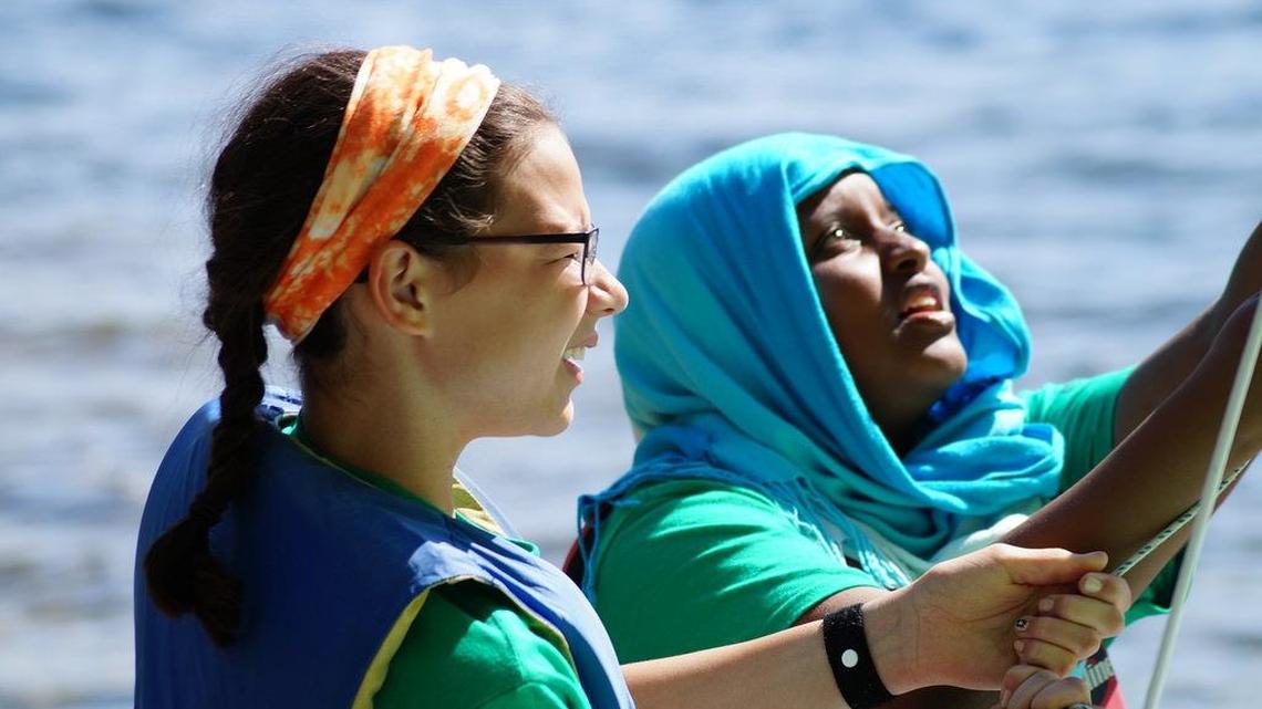 Campers from Maine and Syracuse, New York learning to sail at the Seeds of Peace Camp in Otisfield, Maine, on July 2, 2015