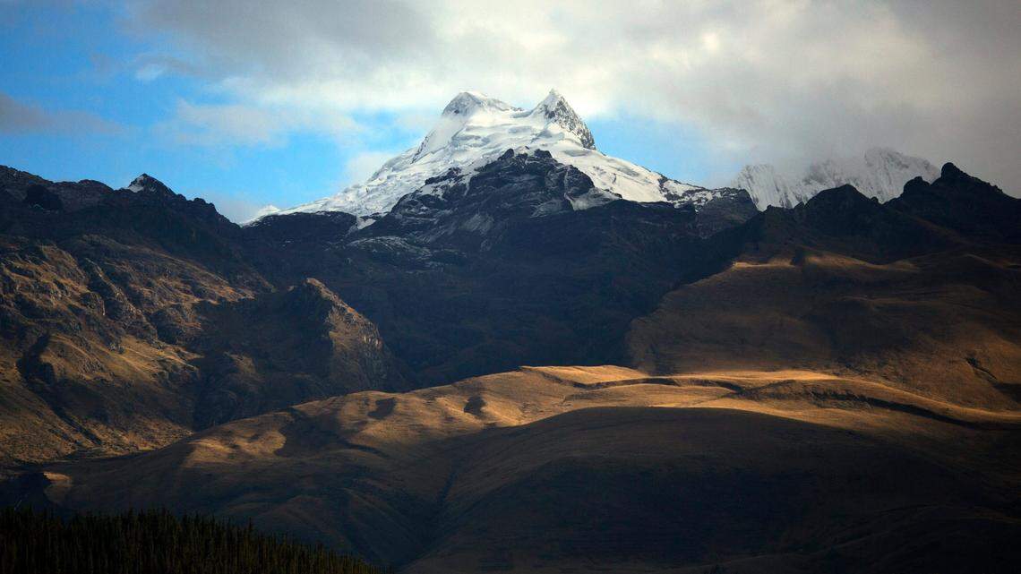 The Vallunaraju mountain stands high in the Andes, early morning in Huaraz, Peru, Wednesday, Dec. 3, 2014. Thirteen “mummified” mice were recently found atop three peaks in the Peruvian Andes. (AP Photo/Rodrigo Abd)
