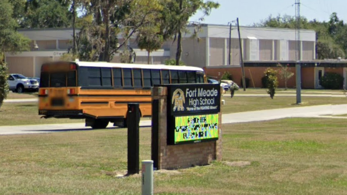 A young alligator was found in the softball field dugout at a school in Fort Meade, Florida, deputies say.