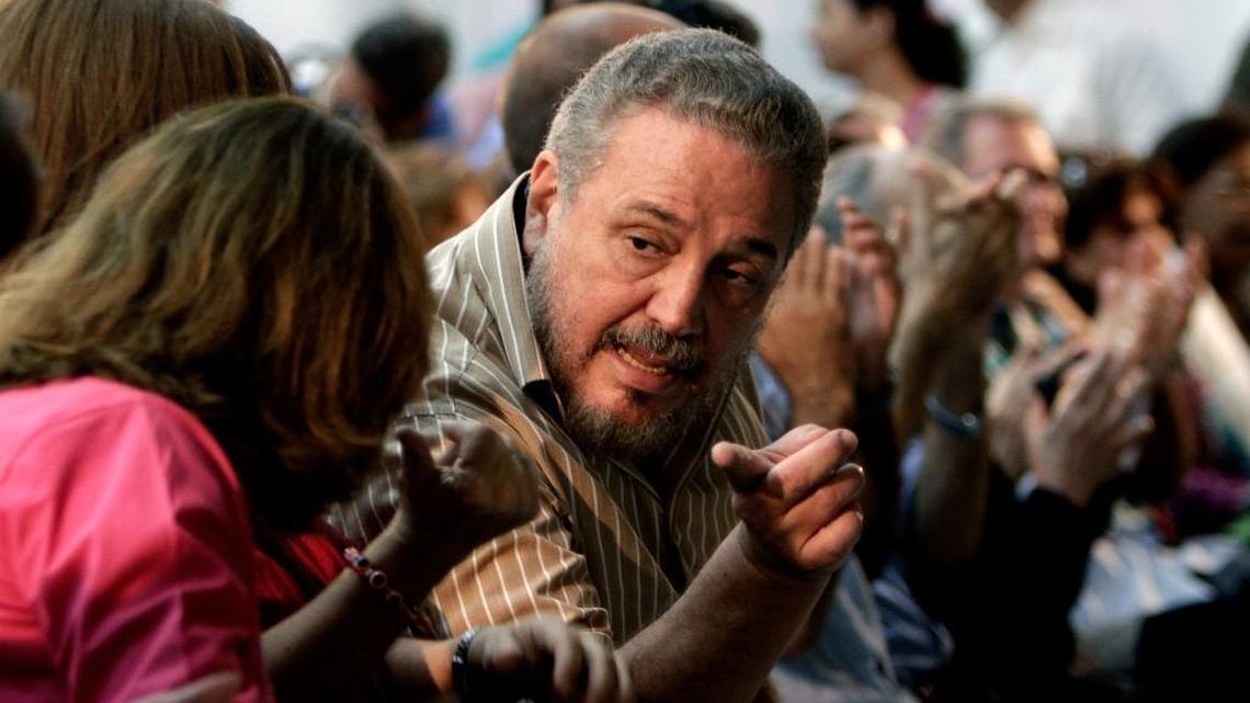In this March 14, 2012, file photo, Fidel Castro Diaz-Balart, son of then Cuban leader Fidel Castro, speaks with an unidentified woman during the presentation of his father's book, “Nuestro Deber es Luchar,” or “Our Duty is to Fight,” in Havana, Cuba. According to Cuban state media on Feb. 1, 2018, Diaz-Balart has killed himself.