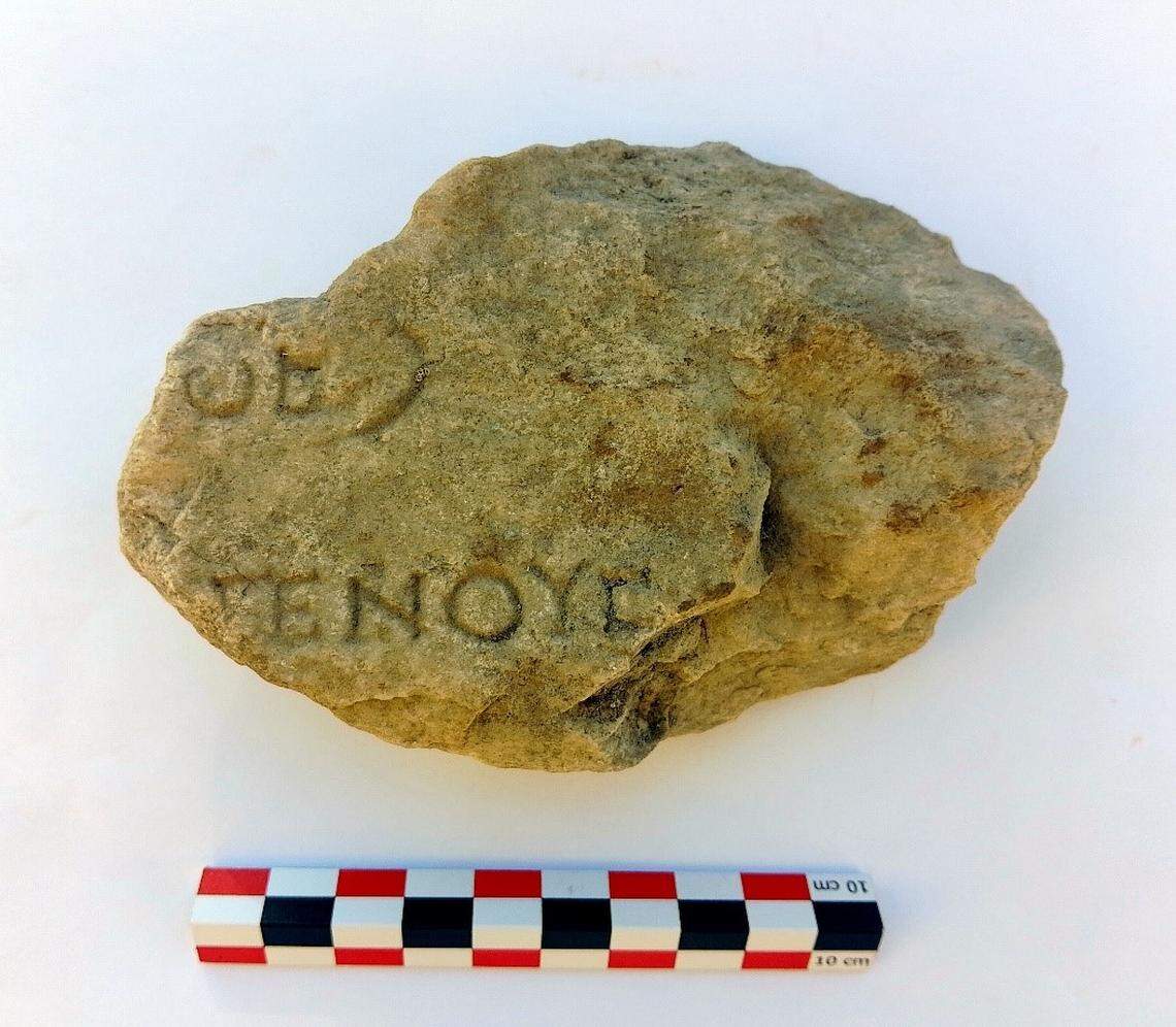 Fragment of a marble column with a partial inscription of a list of names