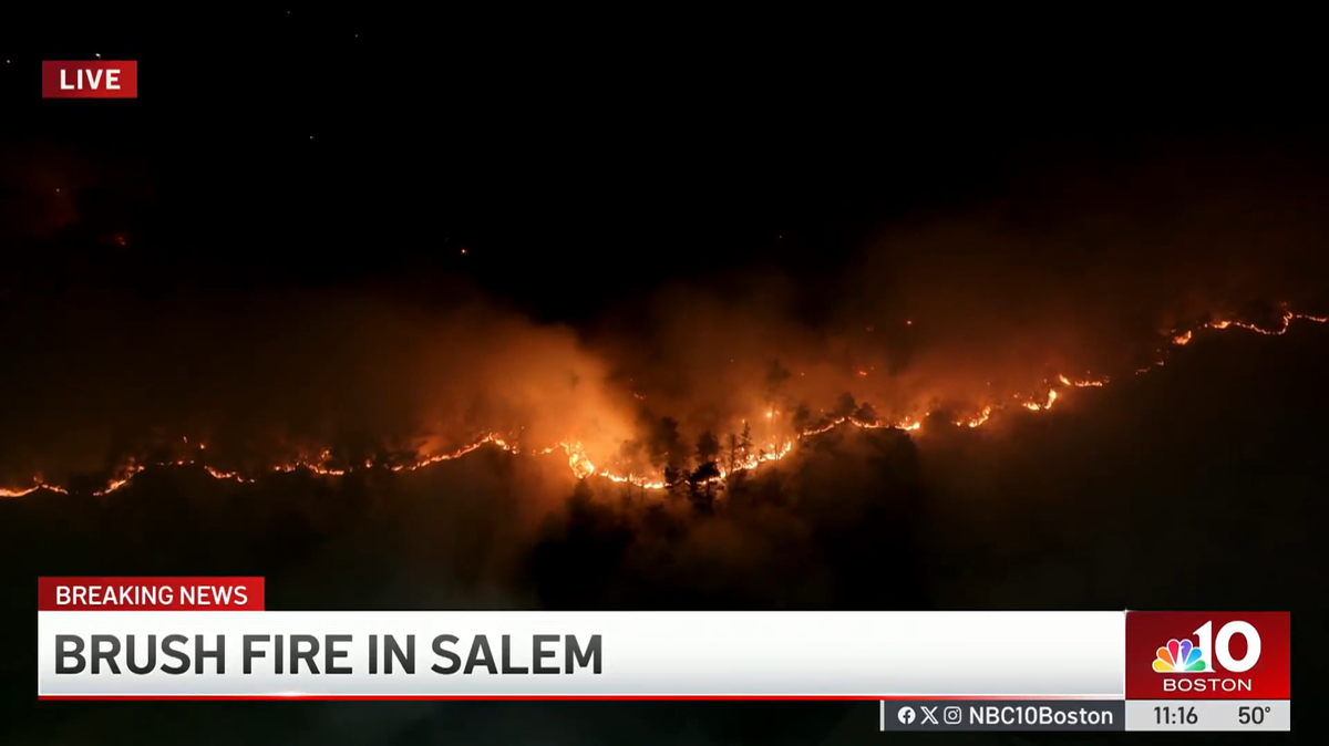 A brush fire is burning through over 60 acres in Massachusetts.