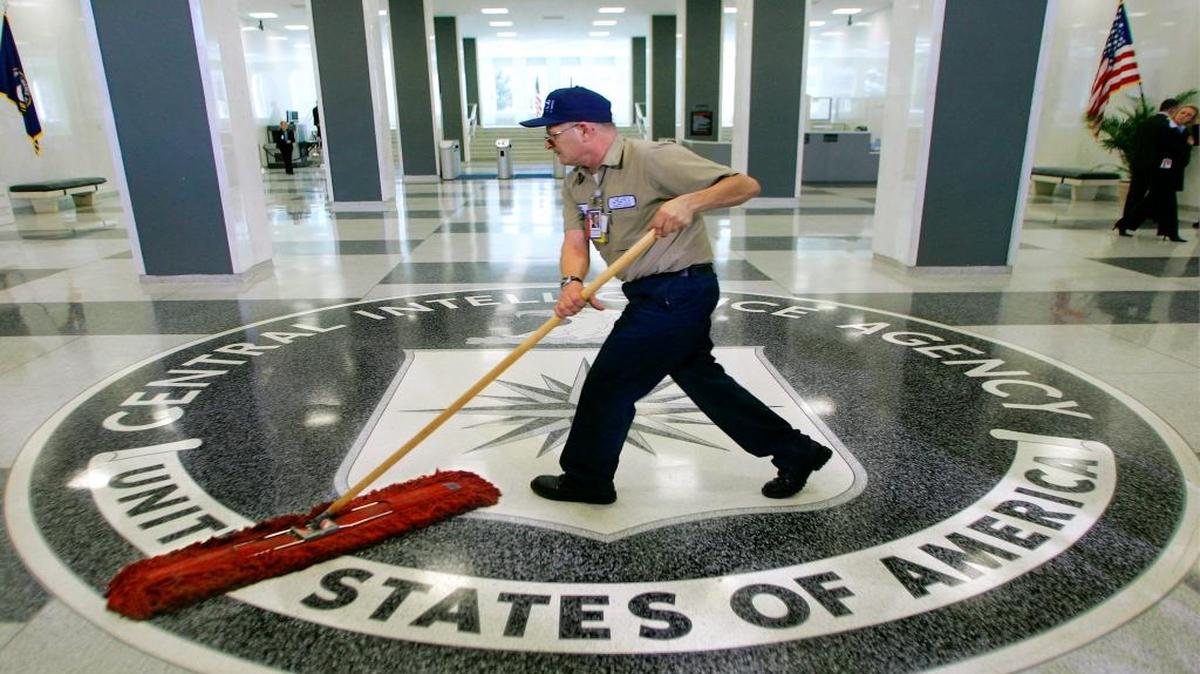 In this March 3, 2005 file photo, a workman slides a dustmop over the floor at the Central Intelligence Agency headquarters in Langley, Va.