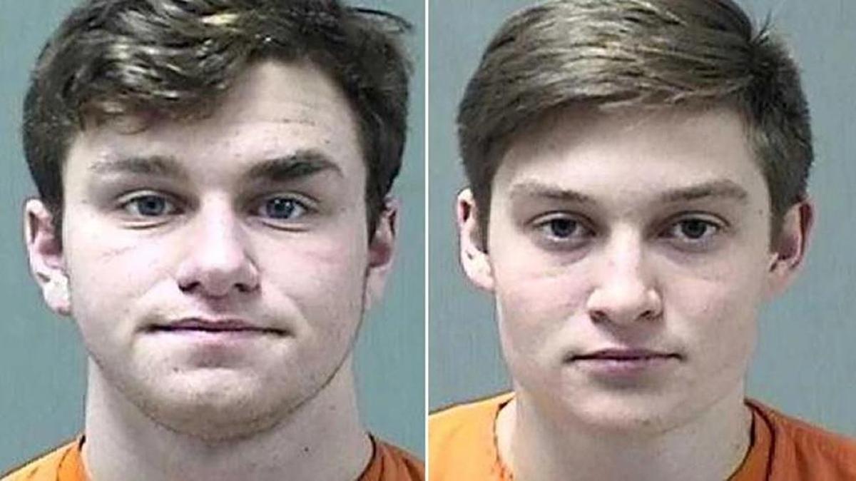 Two Wisconsin 19-year-olds — Willard Hartman, left, and Benjamin Krohn — have been arrested and charged after police say they brought assault rifles, handguns, ammunition and drugs to a basketball game at a Wisconsin school.
