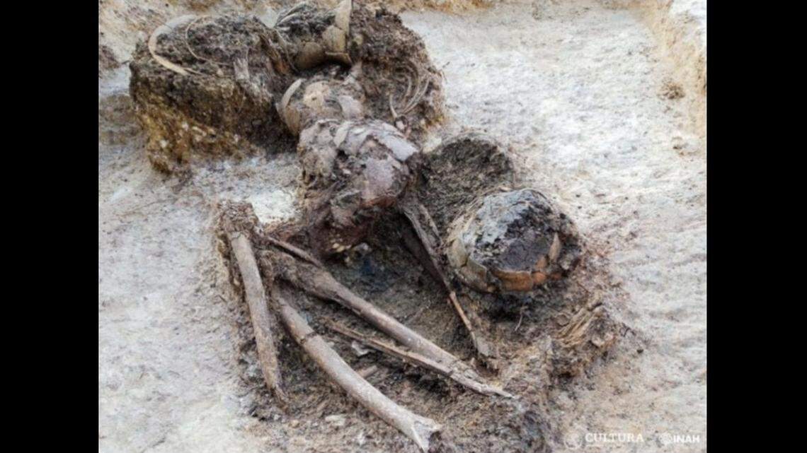 A large grave dating back at least 1,300 years was unearthed near Mexico City, officials said.