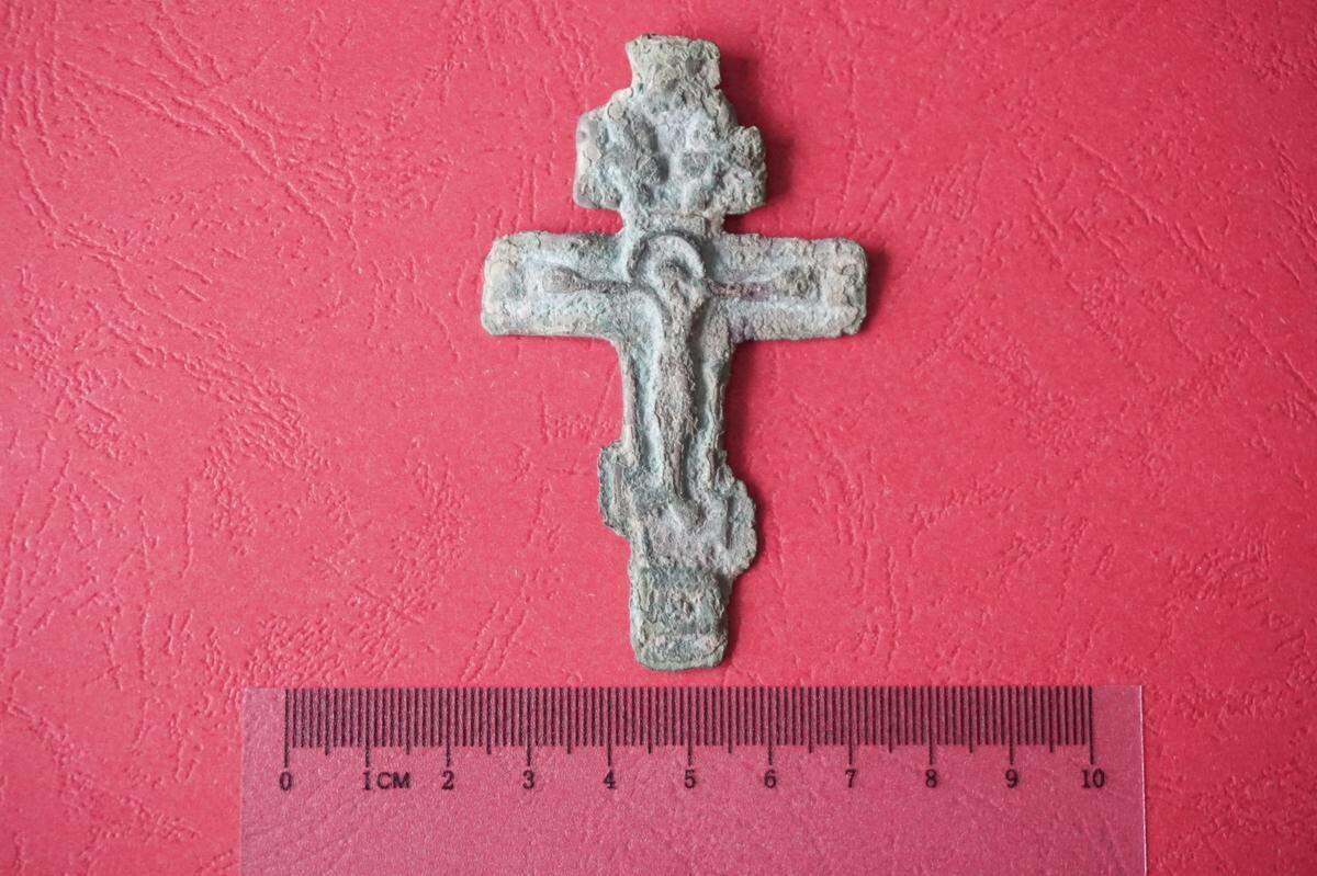 The cross, made from copper alloy, dates to either the 18th or 19th centuries, officials said.