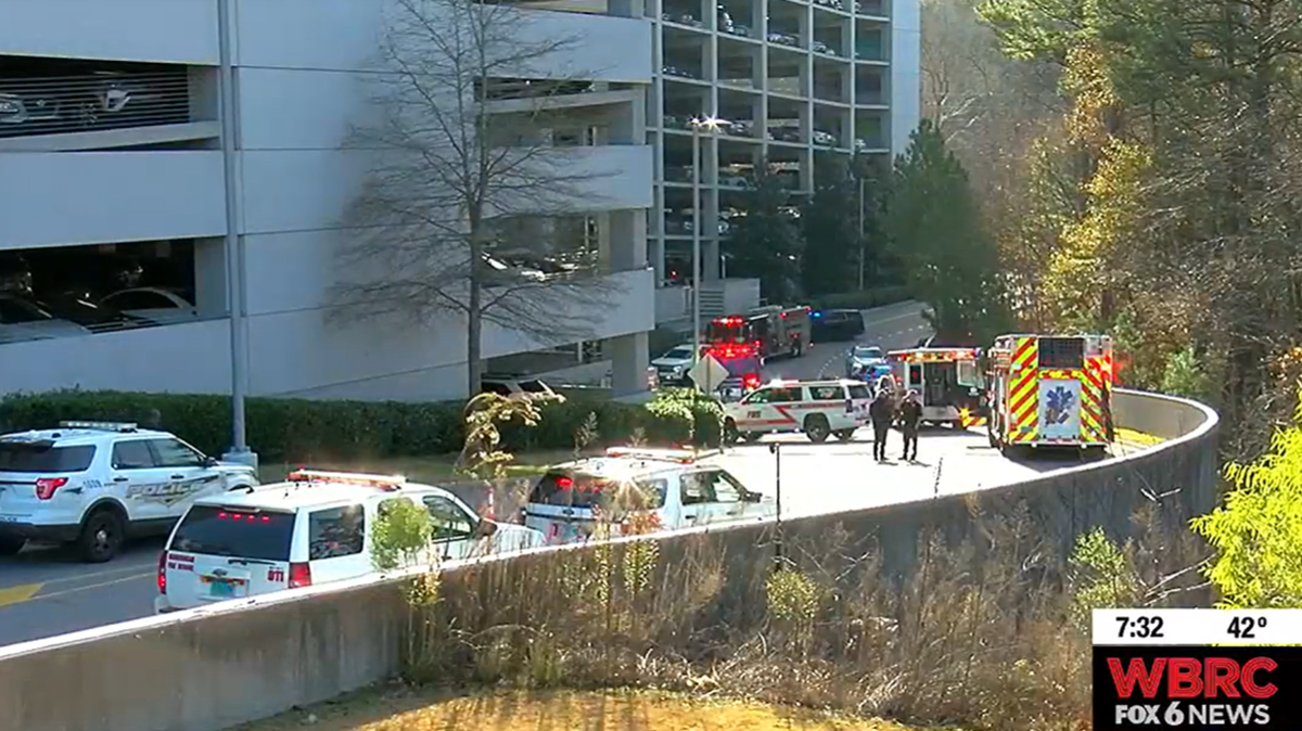 An 82-year-old woman died when her car plummeted from the fifth story of a parking deck at a medical center in Birmingham, officials say.
