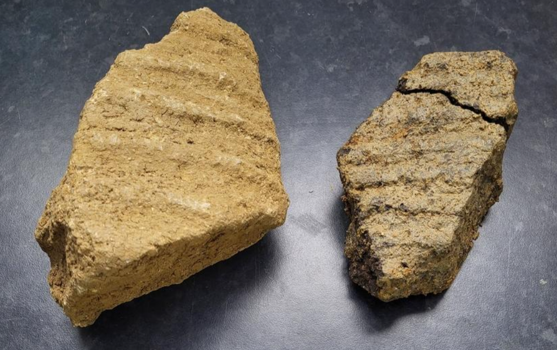 Fragments of millstone uncovered at the site