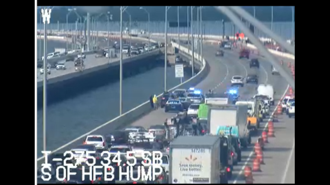 A former assistant U.S. attorney is accused of stabbing another driver after his vehicle was hit on a busy Florida bridge, state troopers said.