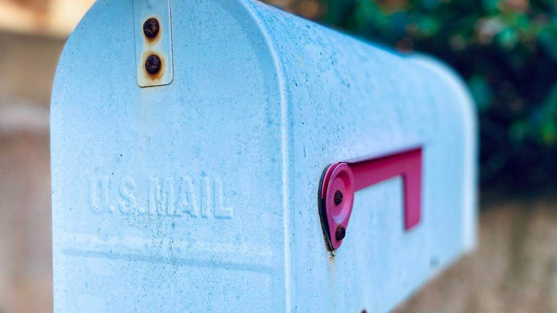 A U.S. mail carrier was arrested on multiple counts of card theft, Georgia police said.
