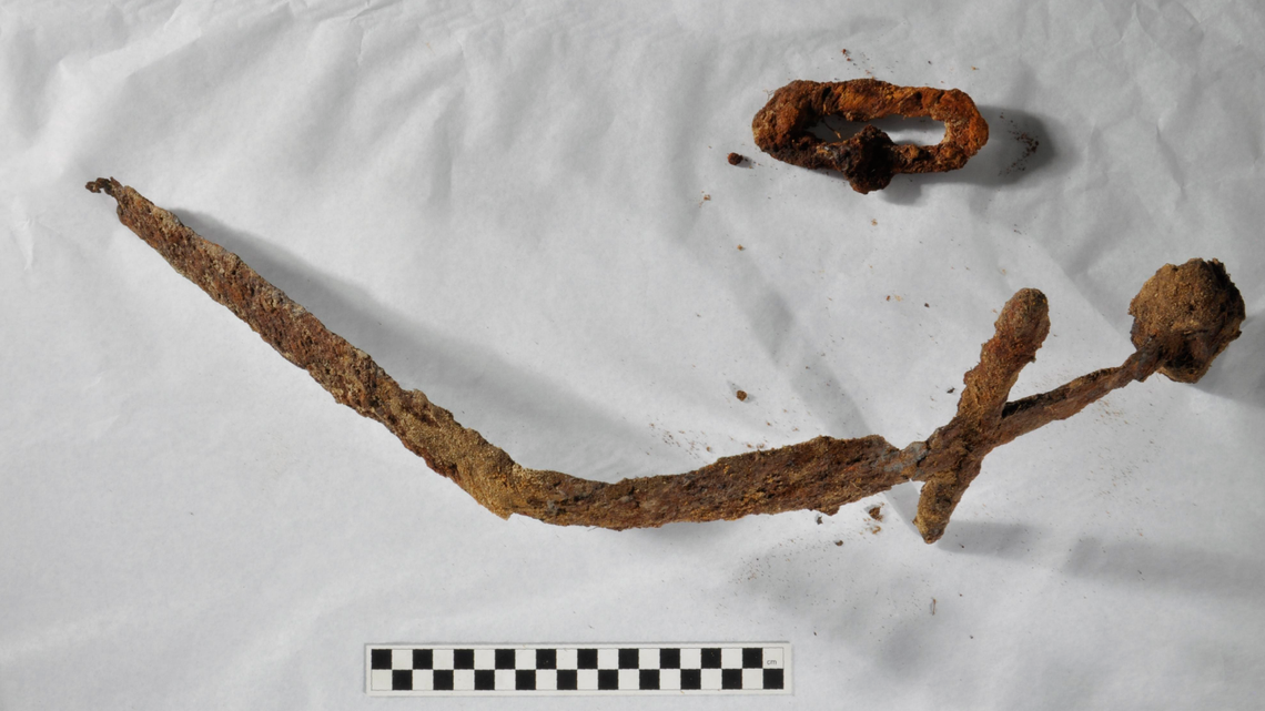 An iron sword seen poking through the soil in Finland led to the discovery of a Crusader-era cemetery, archaeologists said.