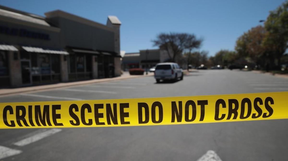 Crime scene tape blocks access to the public as FBI agents collect evidence at a FedEx Office facility following an explosion at a nearby sorting center on March 20, 2018 in Sunset Valley, Texas. The explosion is believed to be related to several recent package bombs that have been detonated in Austin, Texas.
