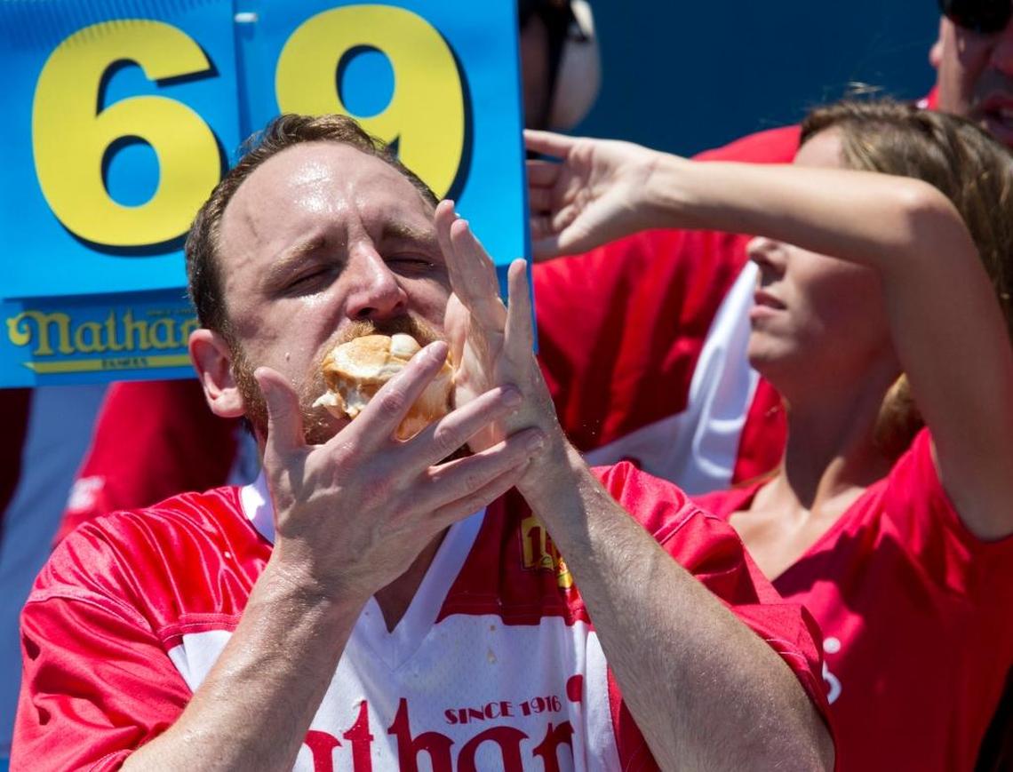 Joey Chestnut competes in Nathan's Famous Fourth of July International Hot Dog Eating Contest men's competition, Monday, July 4, 2016, in New York. Chestnut came in first eating 70 hot dogs and buns in 10 minutes.