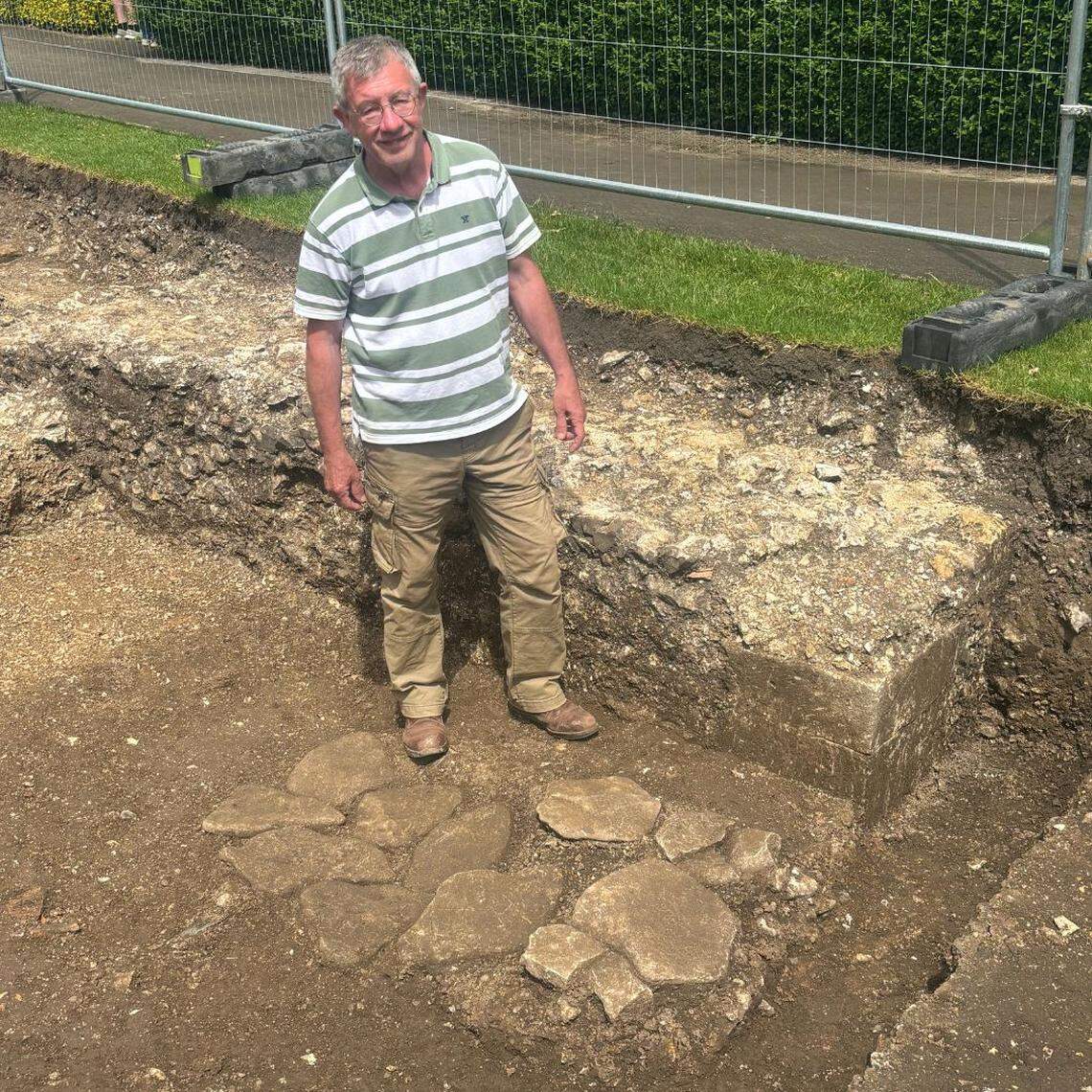 Archaeologist James Kenny stands by the 800-year-old bridge ruins.