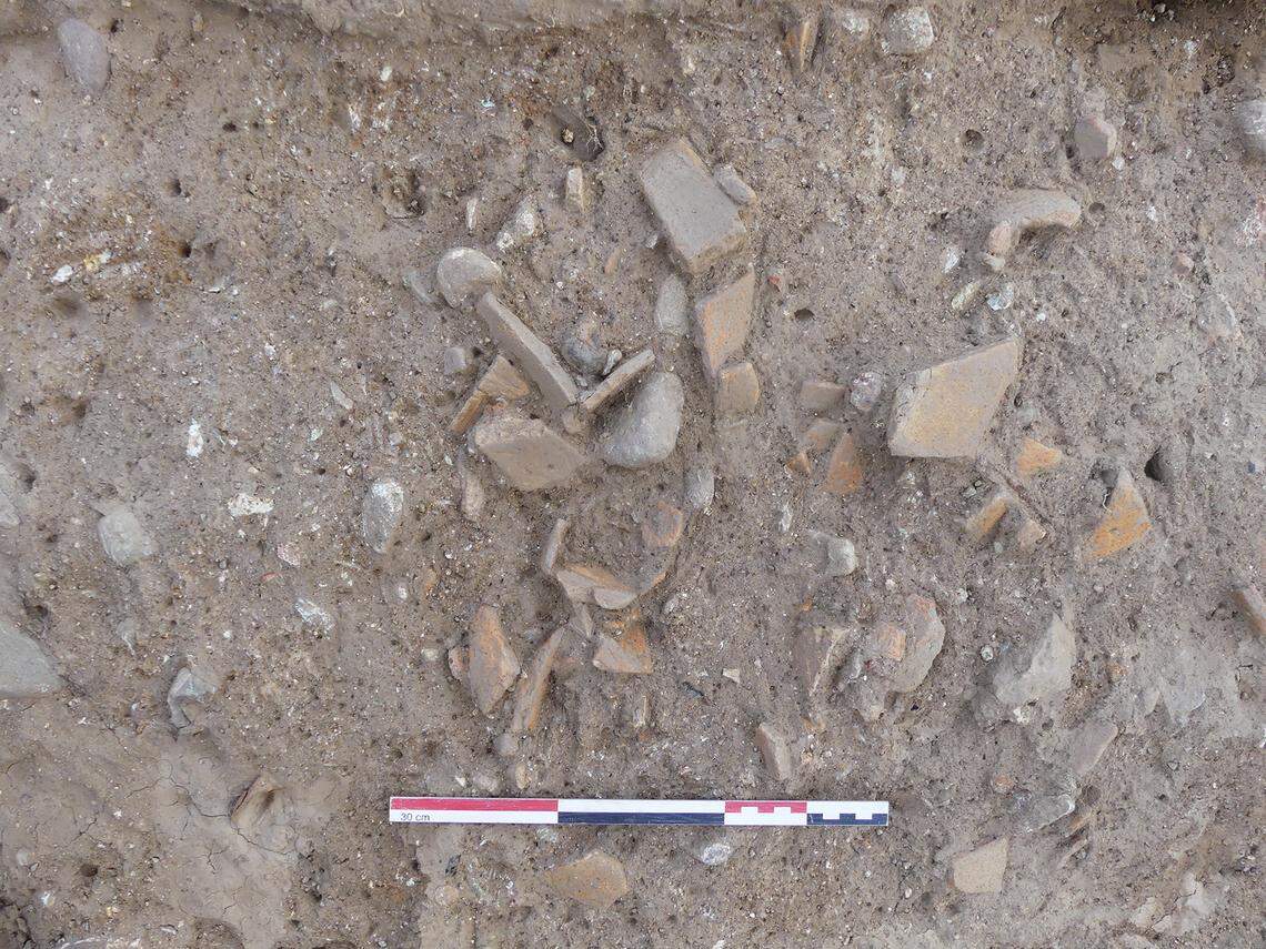 Some broken pottery found at the ancient settlement.