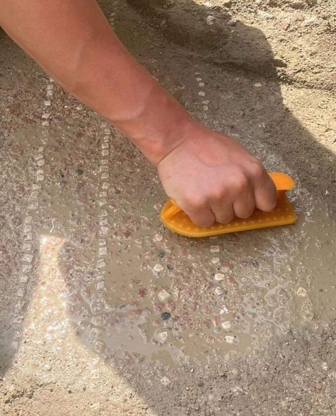 A close-up photo shows the mosaic pattern of the 1,600-year-old indoor pool.