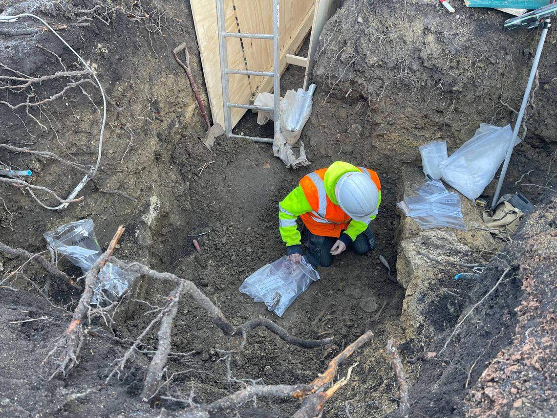 An archaeologist excavating the Old Bell Hotel.