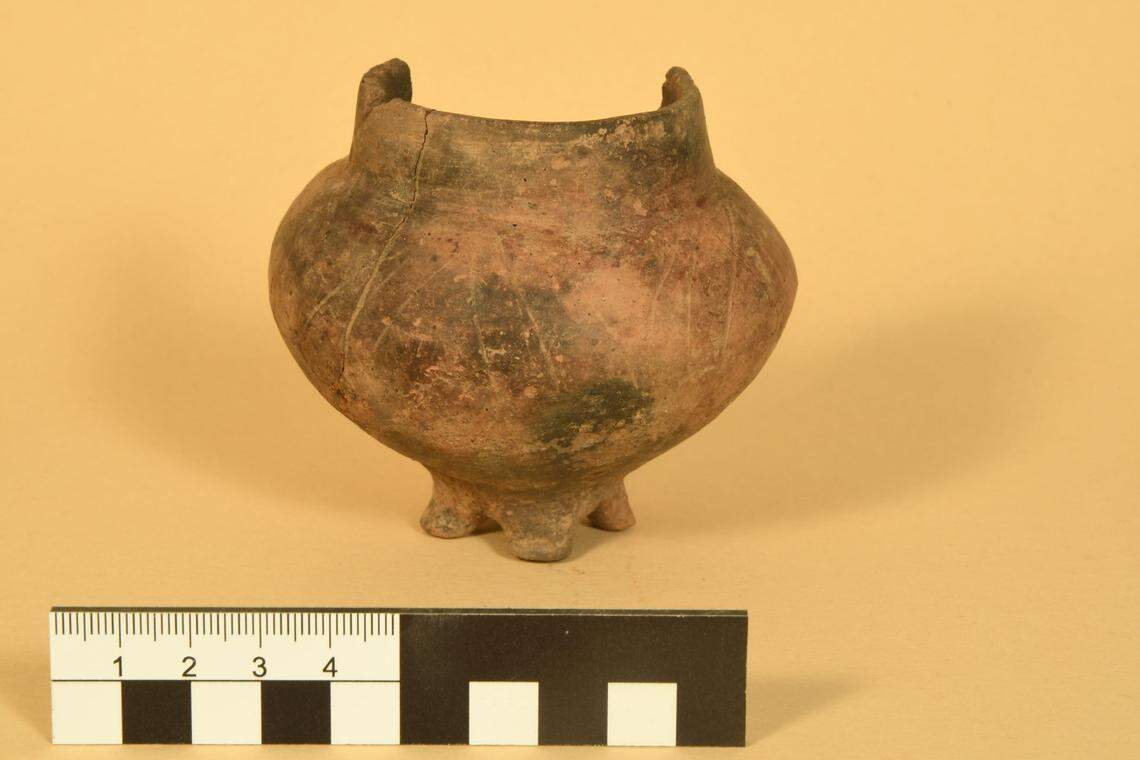 A small jar, likely holding gifts for the dead, found in a 2,000-year-old grave.