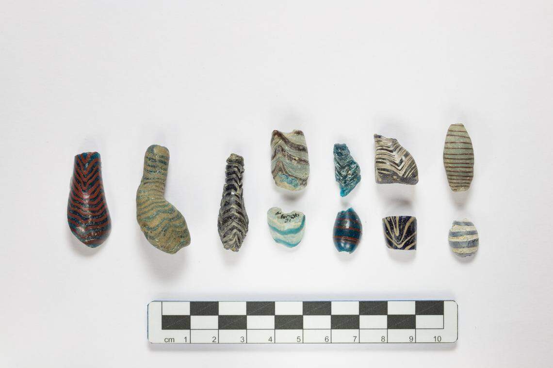 Some ancient glass beads, decorated with spirals, found at Frattesina.