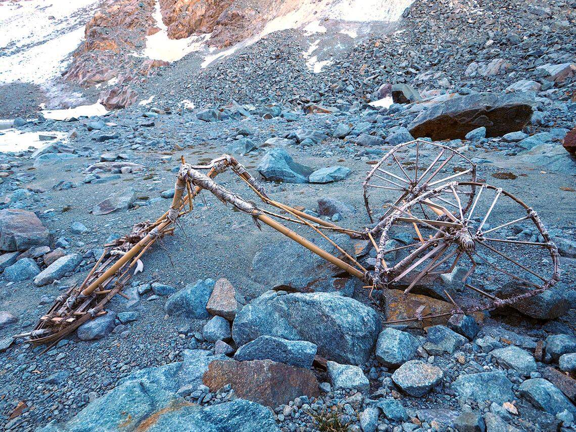 A man hiking at a melting glacier in Splügen Pass stumbled on 20th century bamboo contraption that stumped officials. Photos show the find.