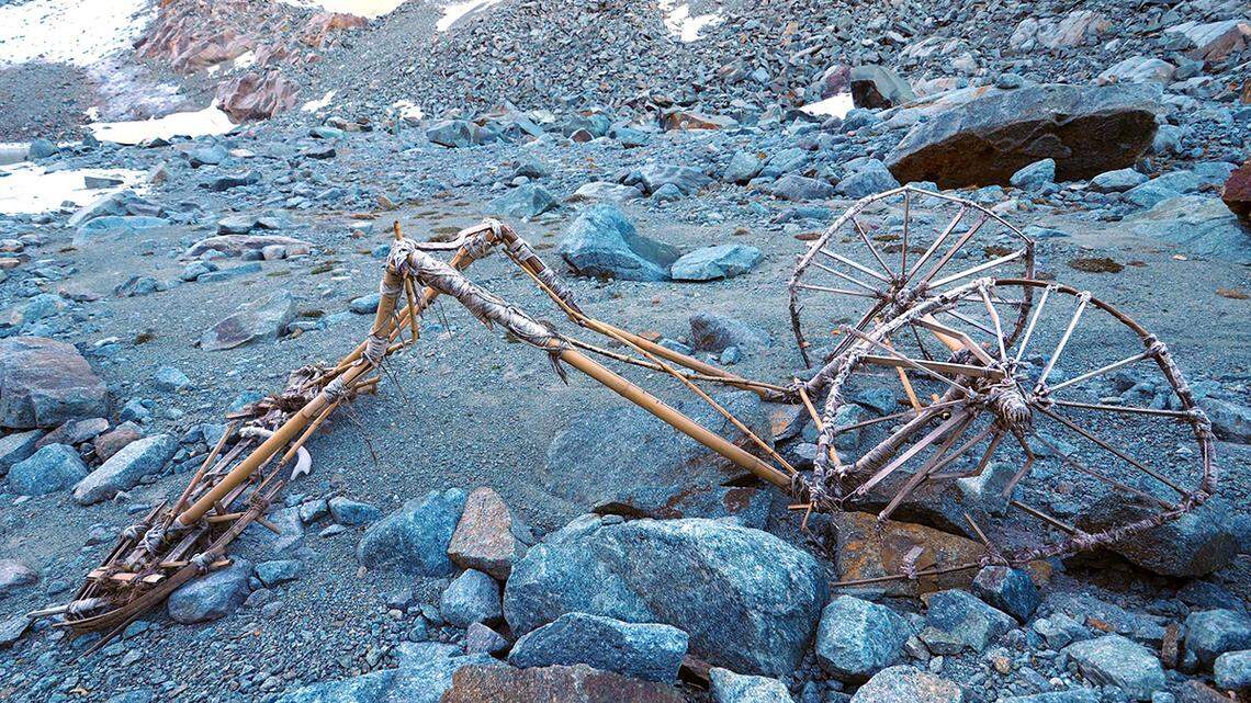 A man hiking at a melting glacier in Splügen Pass stumbled on 20th century bamboo contraption that stumped officials. Photos show the find.