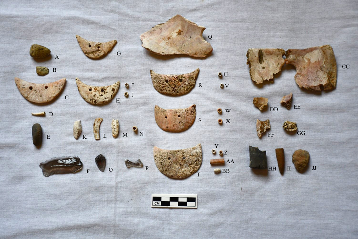Shell beads and other items were found buried with the woman, including pieces over her eyes, researchers said.