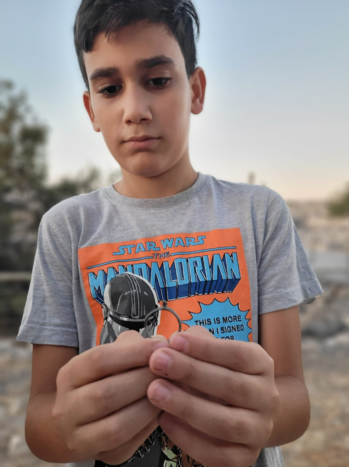Itamar holding the ring he found.