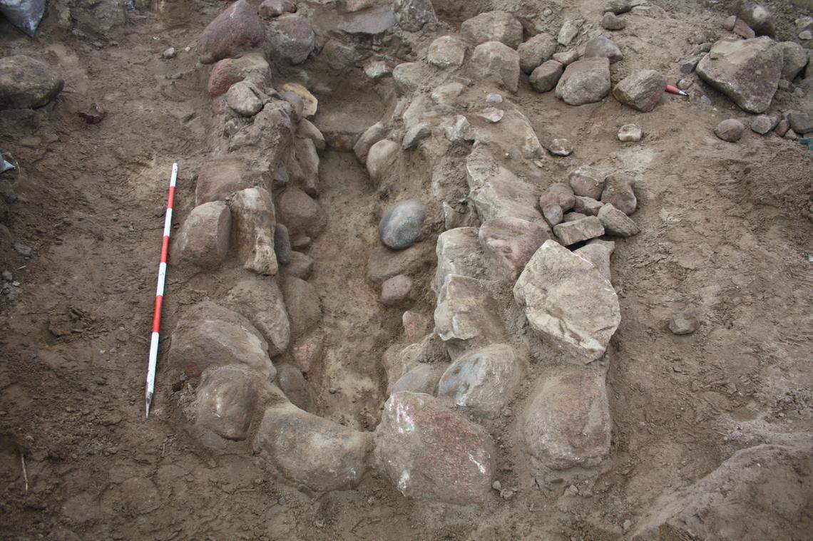 The 4,000-year-old stone grave as seen during excavations.