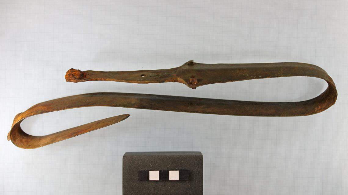 Archaeologists said the sword was bent as part of a ritual offering.