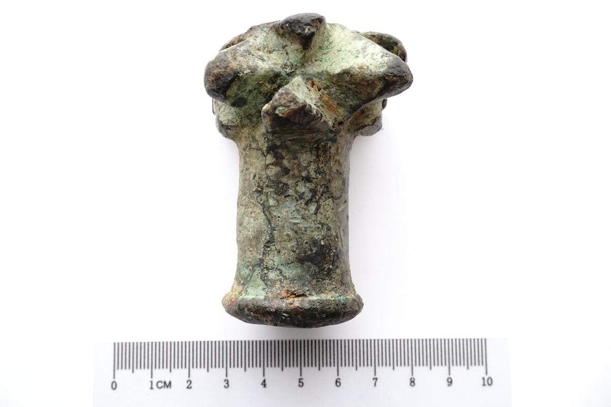 One side of the 600-year-old mace head found by Witold Bołtuć.